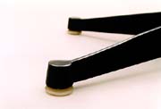Charles Eames ES670 lounge chair and ES671 ottoman glides. Parts for the Herman Miller and Vitra European version 670 / 671 lounge chair and ottoman. Photography �2007 Graham Mancha.