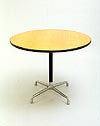 Charles Eames Aluminium Group table. Circular light oak veneered work surface supported on a single black painted pedestal and four-star 'universal' aluminum base. 91cm diameter x 72cm high. Manufactured by Herman Miller. Photography �2007 Graham Mancha