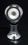 Magna Spot table lamp. Chrome base supporting an adjustable spherical chrome lamp holder held in place by magnetism. Manufactured by The Modern Lighting Company, UK. Photography �2007 Graham Mancha